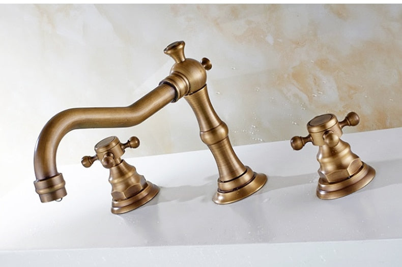 Vintage Style Bathroom Faucet with Cross Handles shown in Antique Bronze