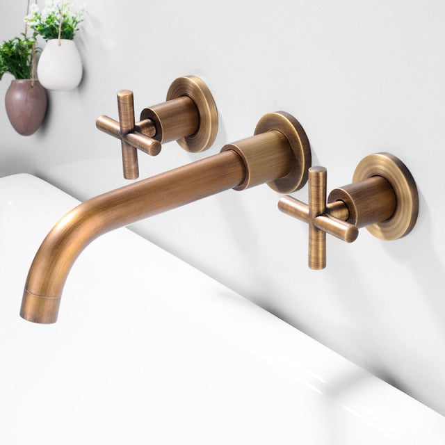 wall mounted bathroom faucet with cross handles in bronze finish