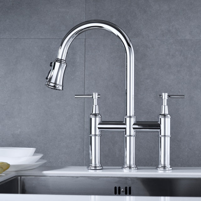Contemporary three hole deck mounted Bridge kitchen faucet with pull down sprayer in polished chrome