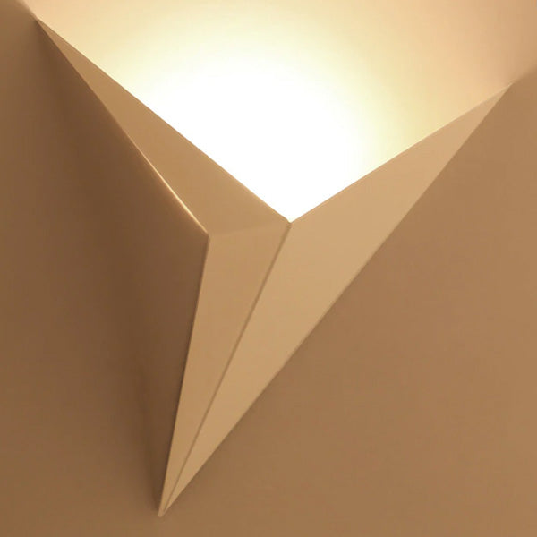 White geometric wall sconce shown on